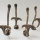 Four patères bronze patinated leafy décor early 20th century
