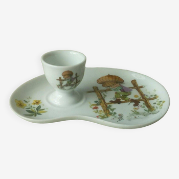 Porcelain egg cup on frame Limoges Poulbot de Paris