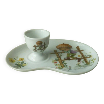 Porcelain egg cup on frame Limoges Poulbot de Paris