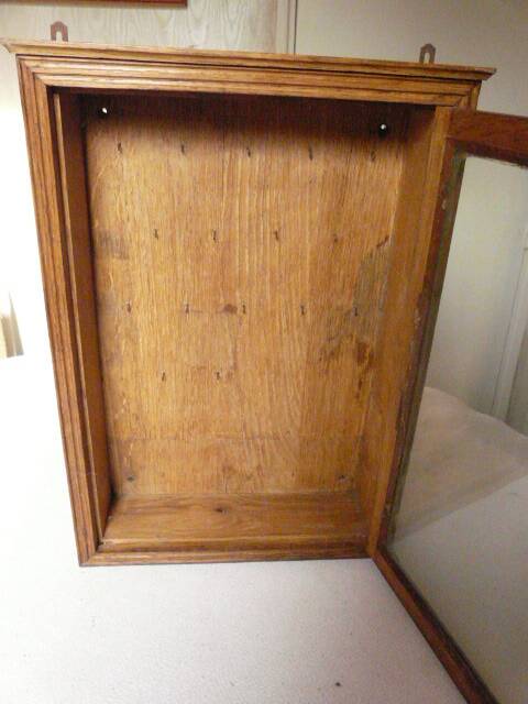 Old watchmaker's furniture wall display case