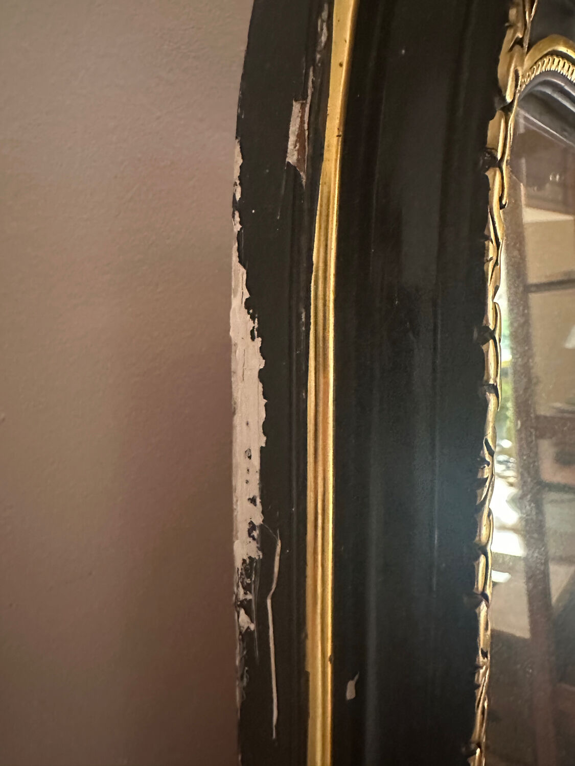 Napoleon III mirror with a pediment featuring black and gold dragons and birds.