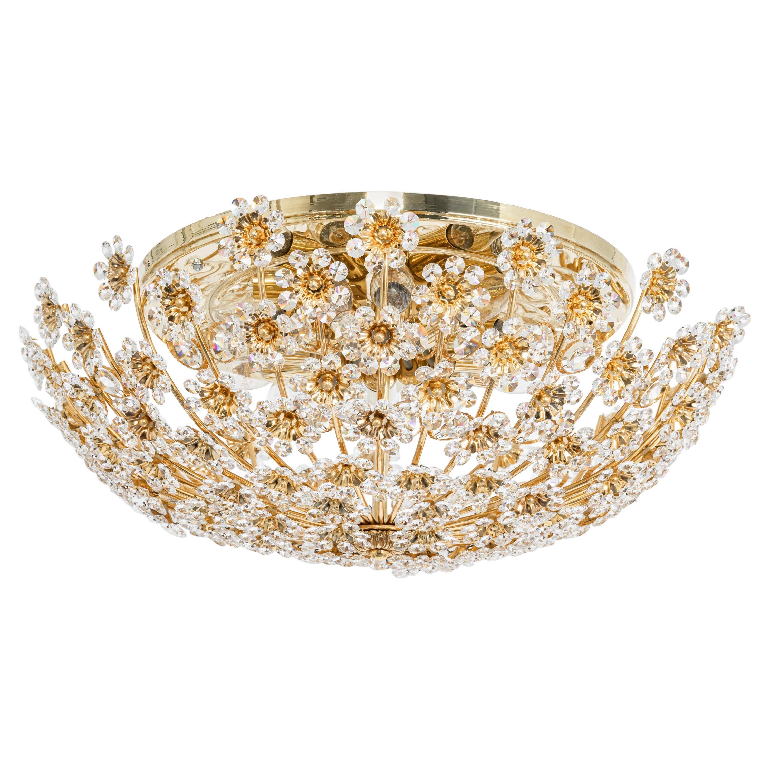 Small delicate ceiling light in gilded brass and cut glass in the shape of flowers by Palwa, Germany, 1970s.