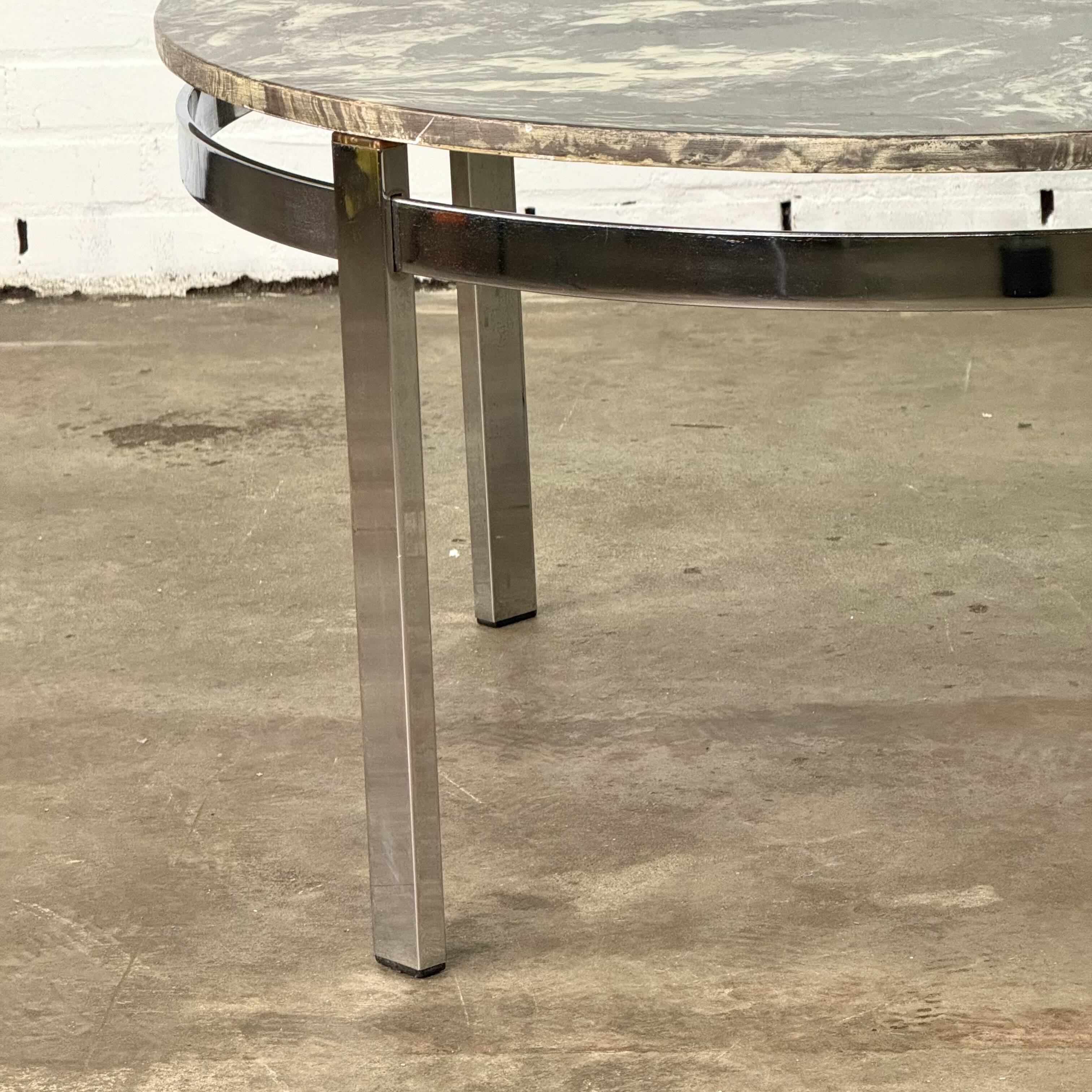 Round vintage coffee table with marble top and chrome base