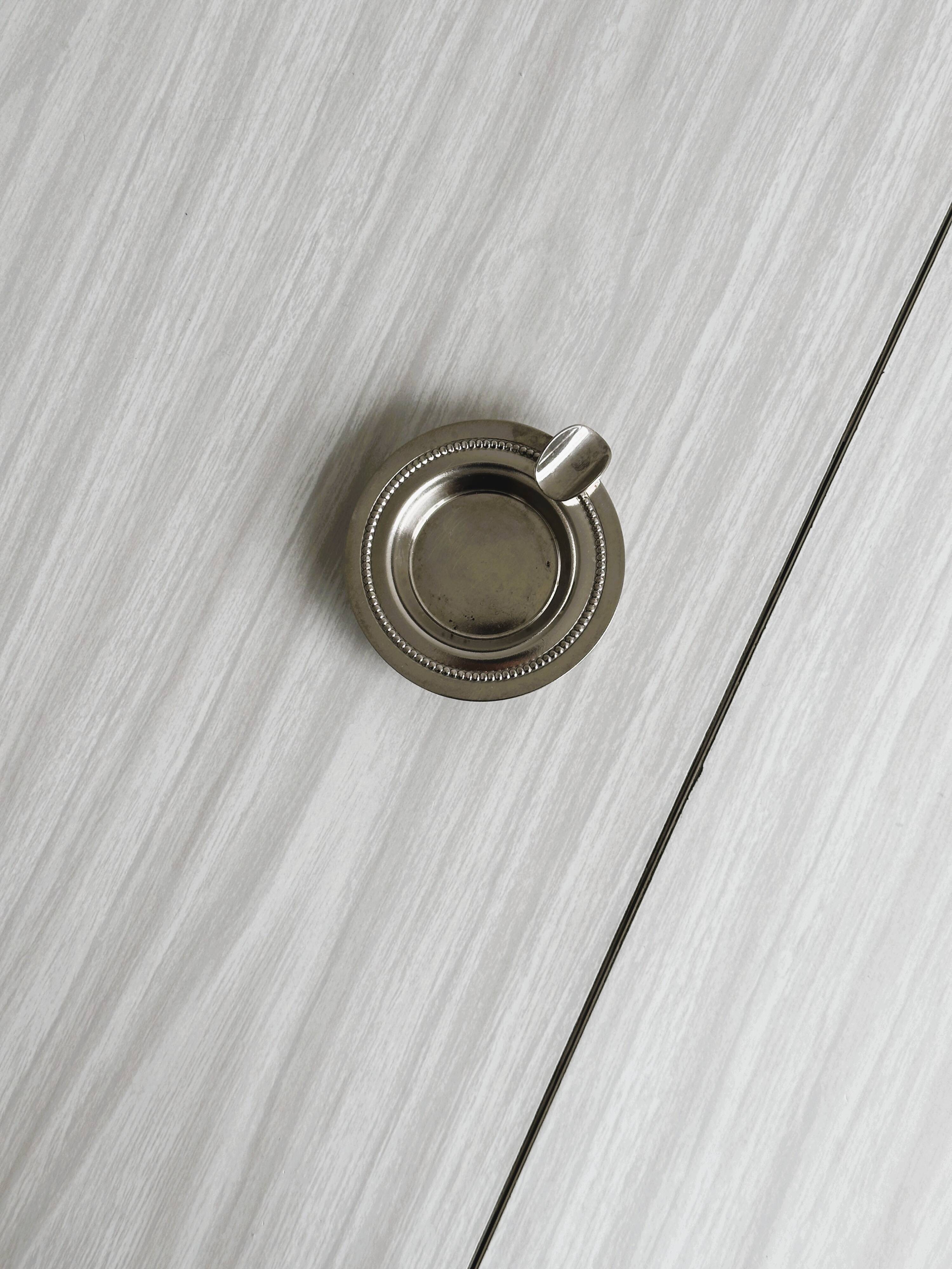 Small ashtray in shiny silver metal