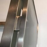 Beautiful console table in brushed metal with bluish glass shelves