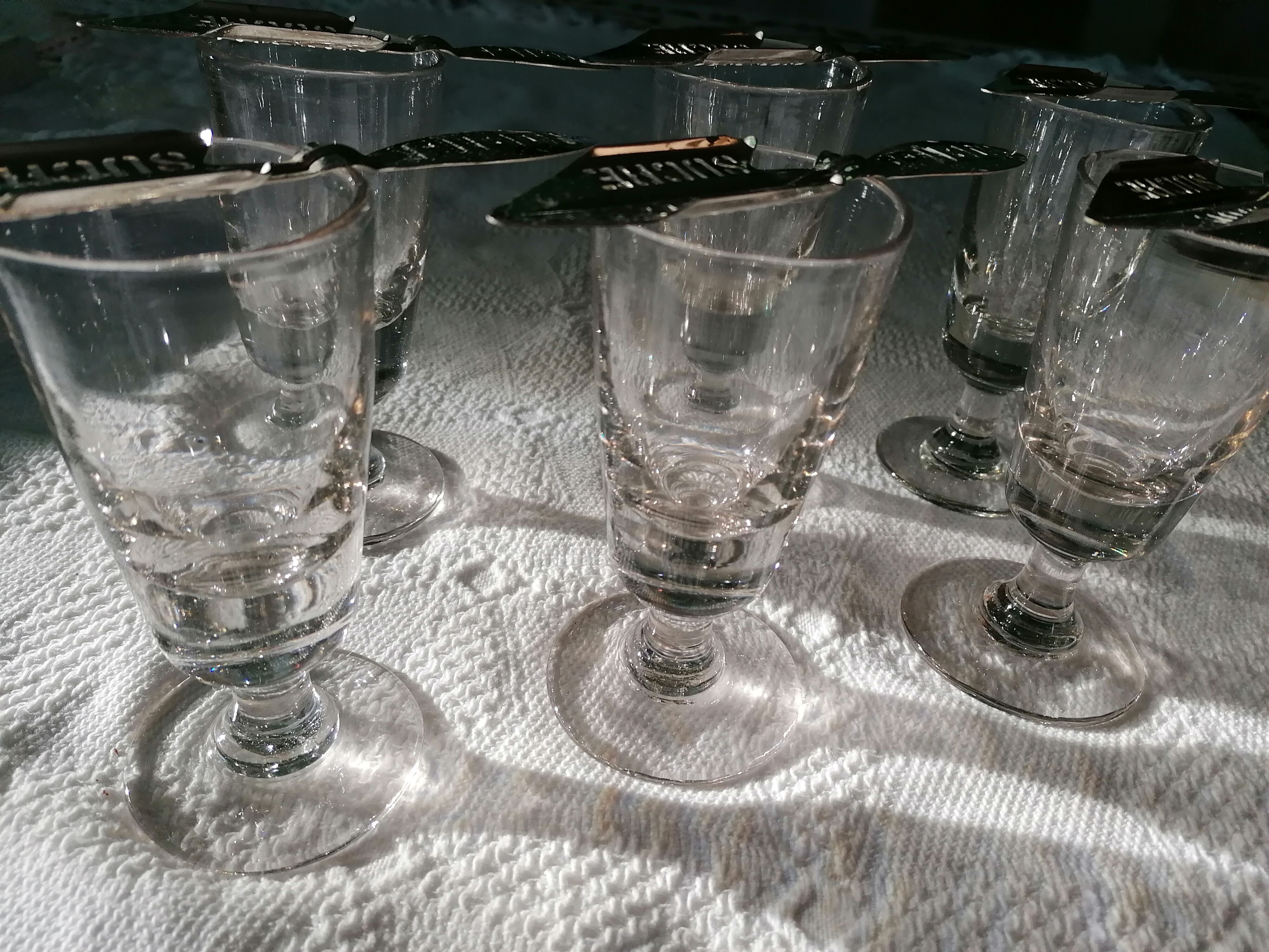 Absinthe service glasses and spoons.