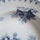 Antique deep plates in ironstone with a soup tureen.