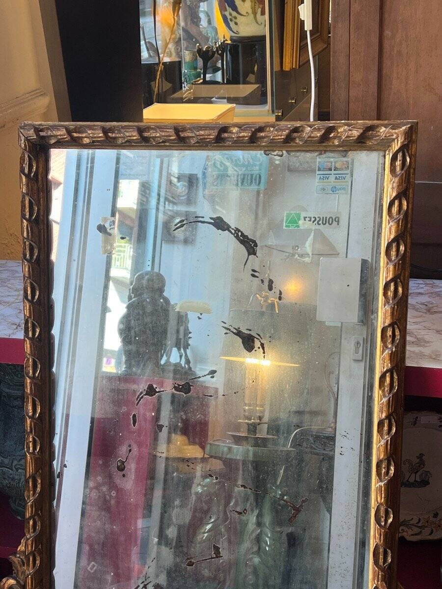 Antique mirror above a chest of drawers or between two windows, carved wood, 18th century