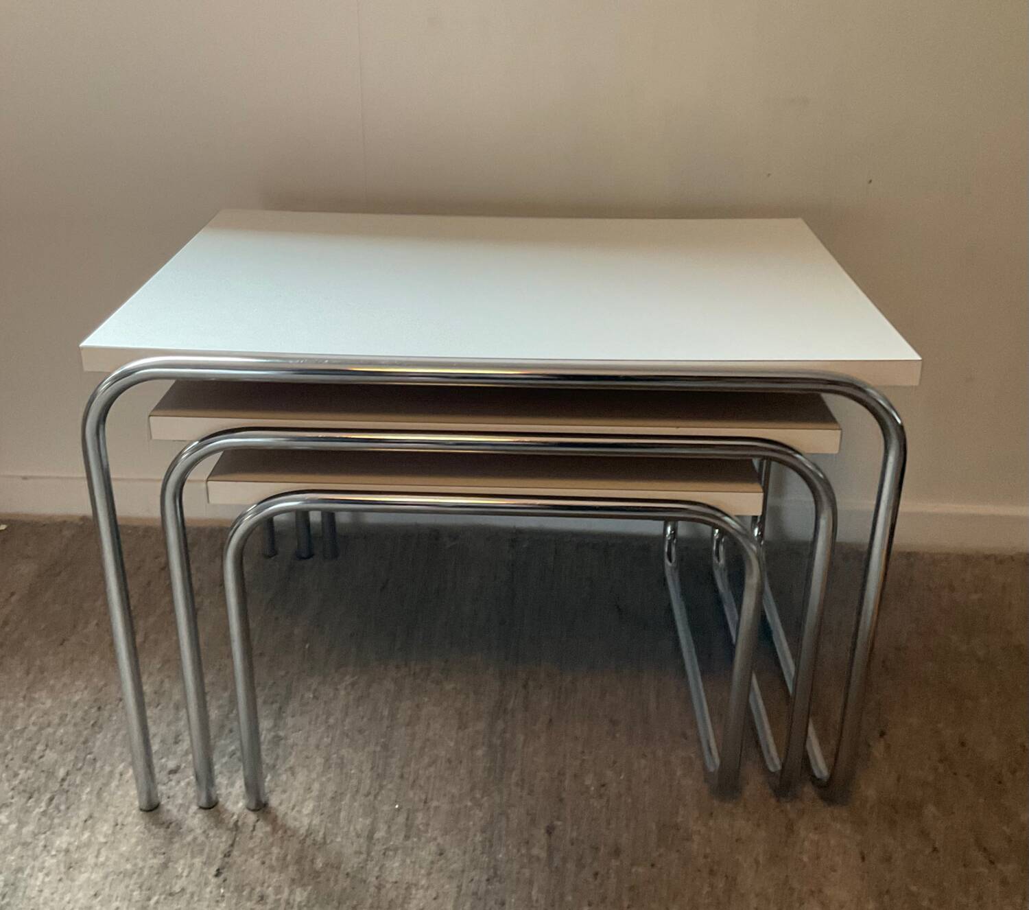 Trio of vintage nesting tables in Formica and chrome metal