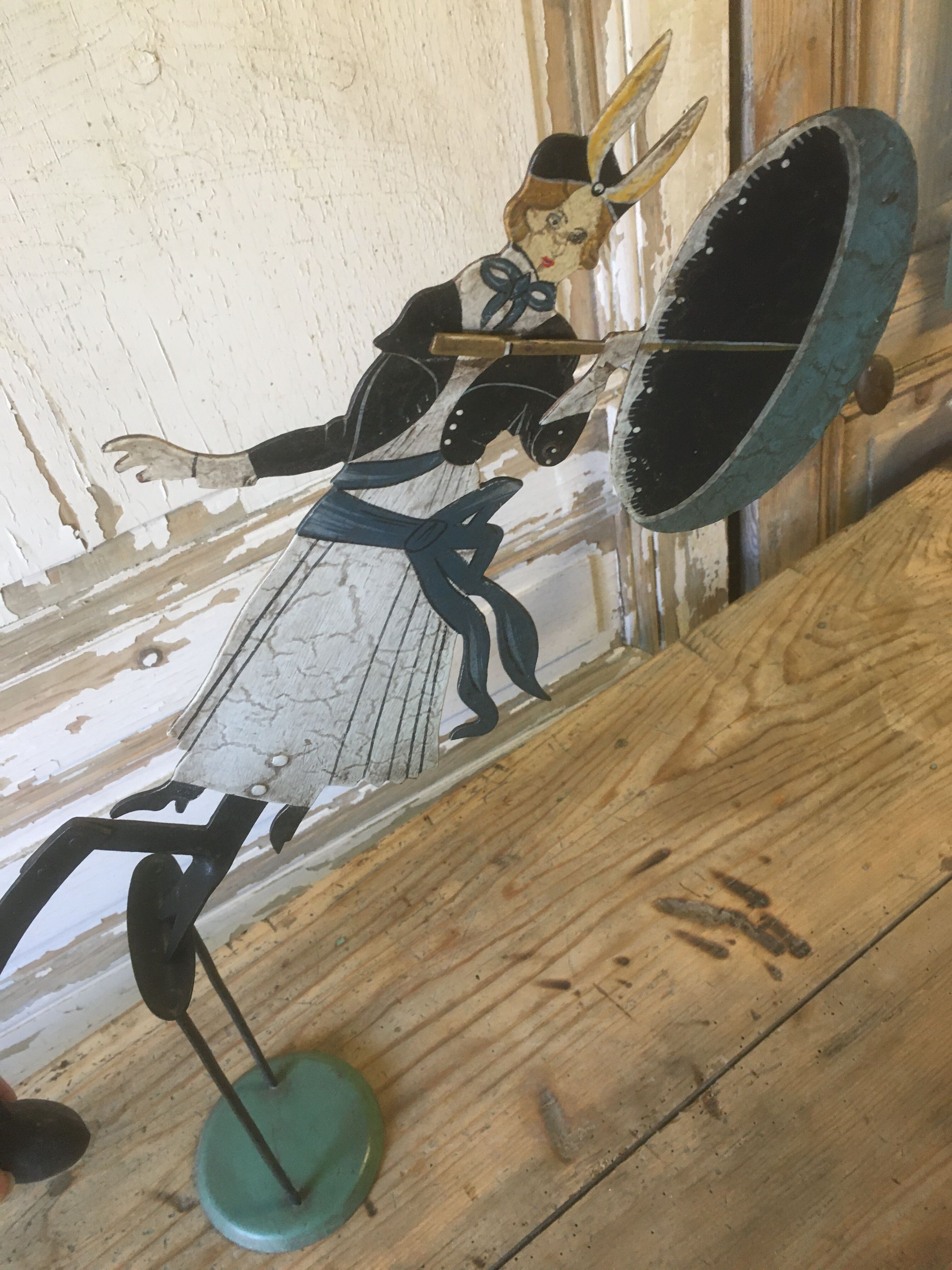 Woman with metal umbrella, pendulum