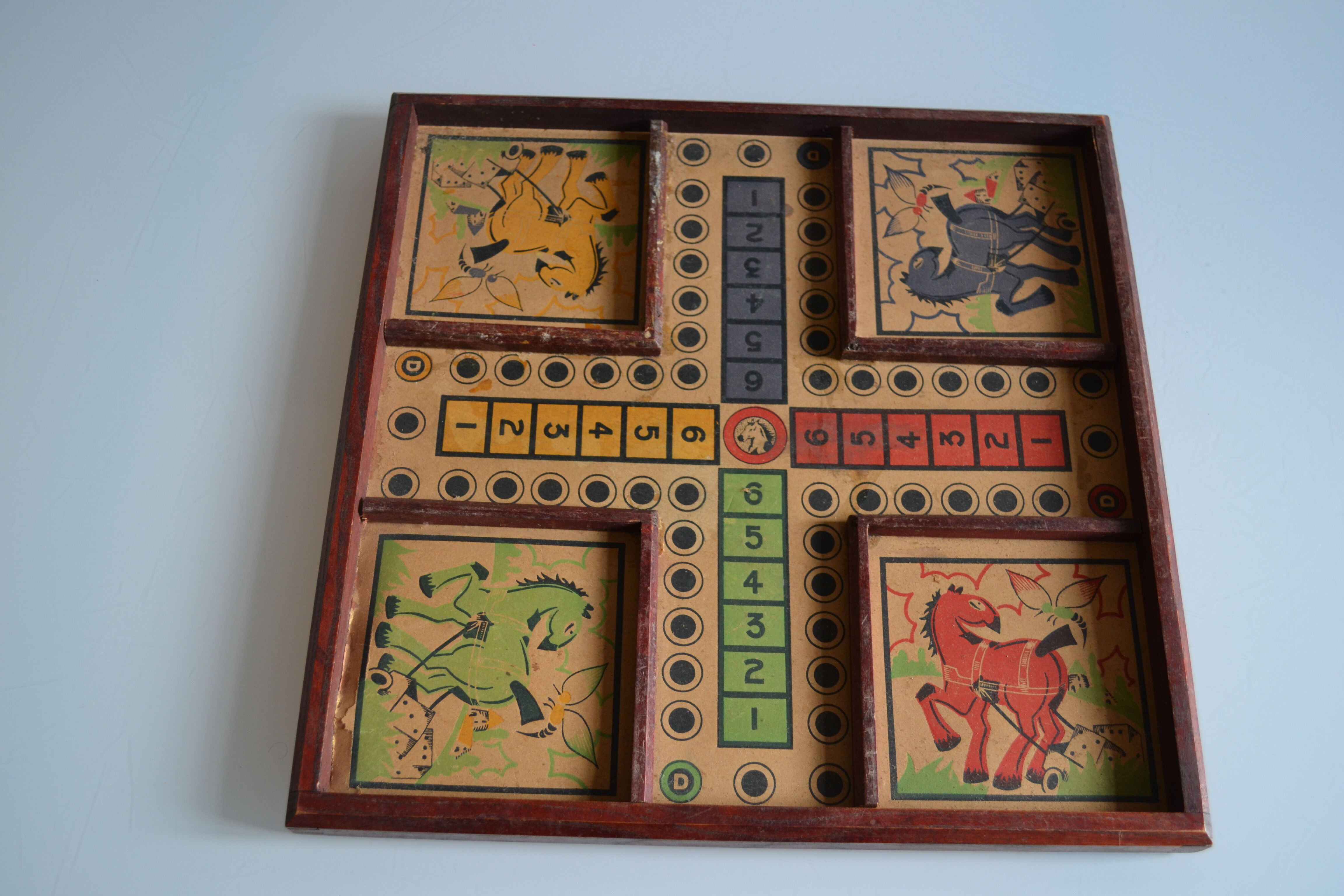 Old game board of small horses