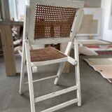 4 folding chairs with wicker seating