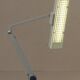 WALDMANN articulated workshop lamp with two industrial clamp arms for architects.