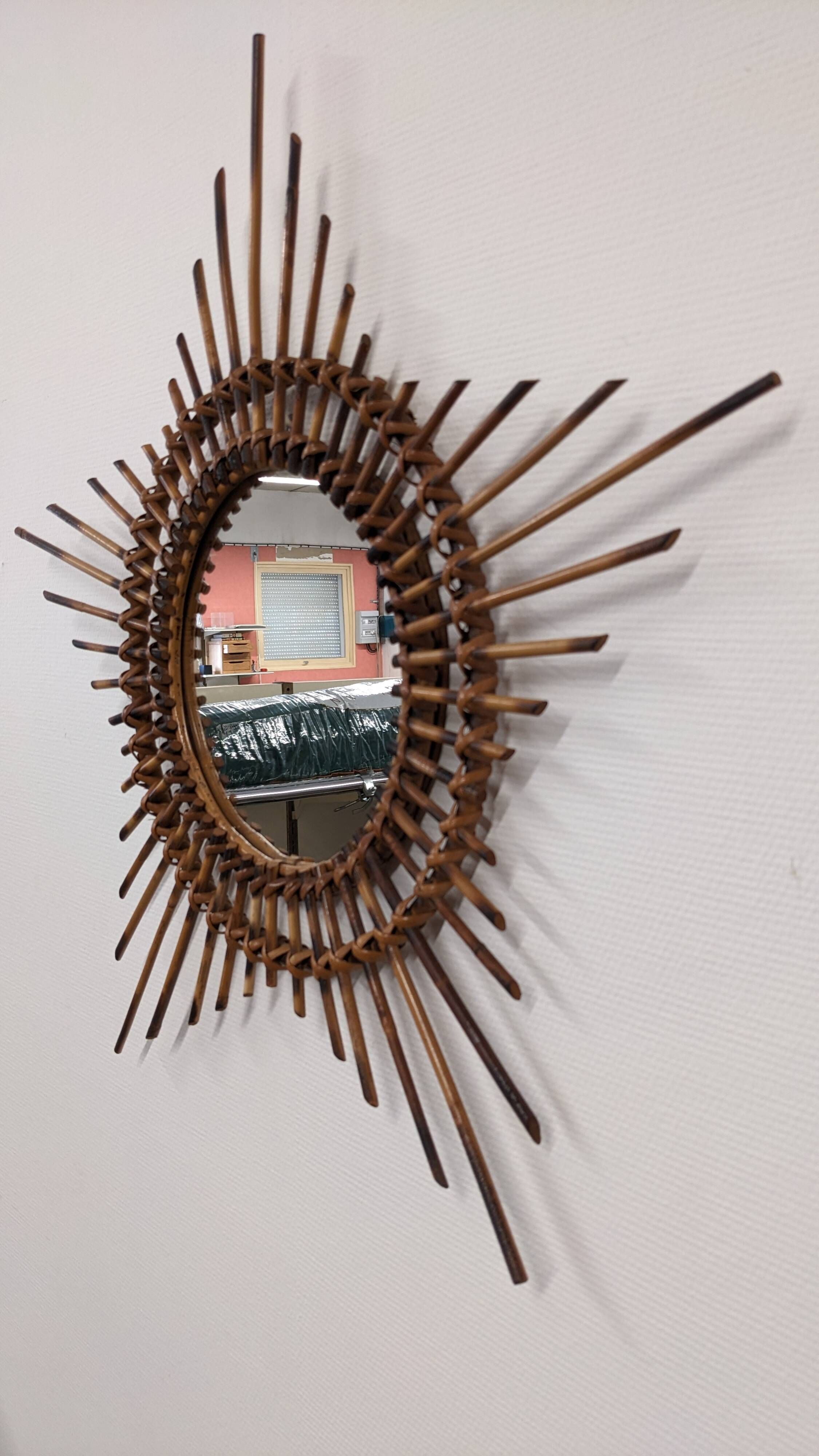Starry sun mirror in rattan, France around 1960.
