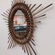 Starry sun mirror in rattan, France around 1960.