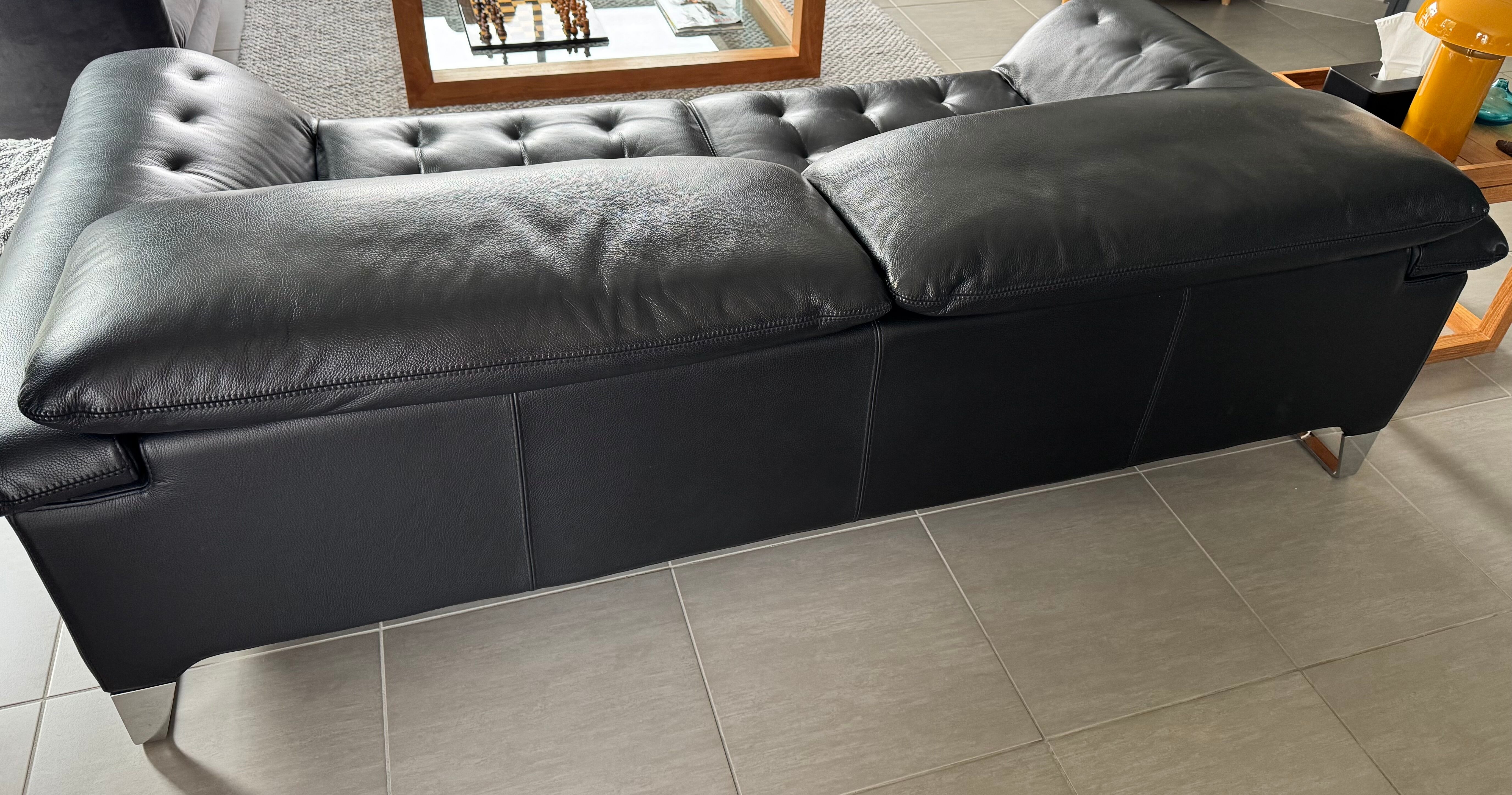 Two-seater black leather sofa Roche Bobois