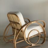 Large rattan rest chair and white cushions