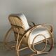 Large rattan rest chair and white cushions