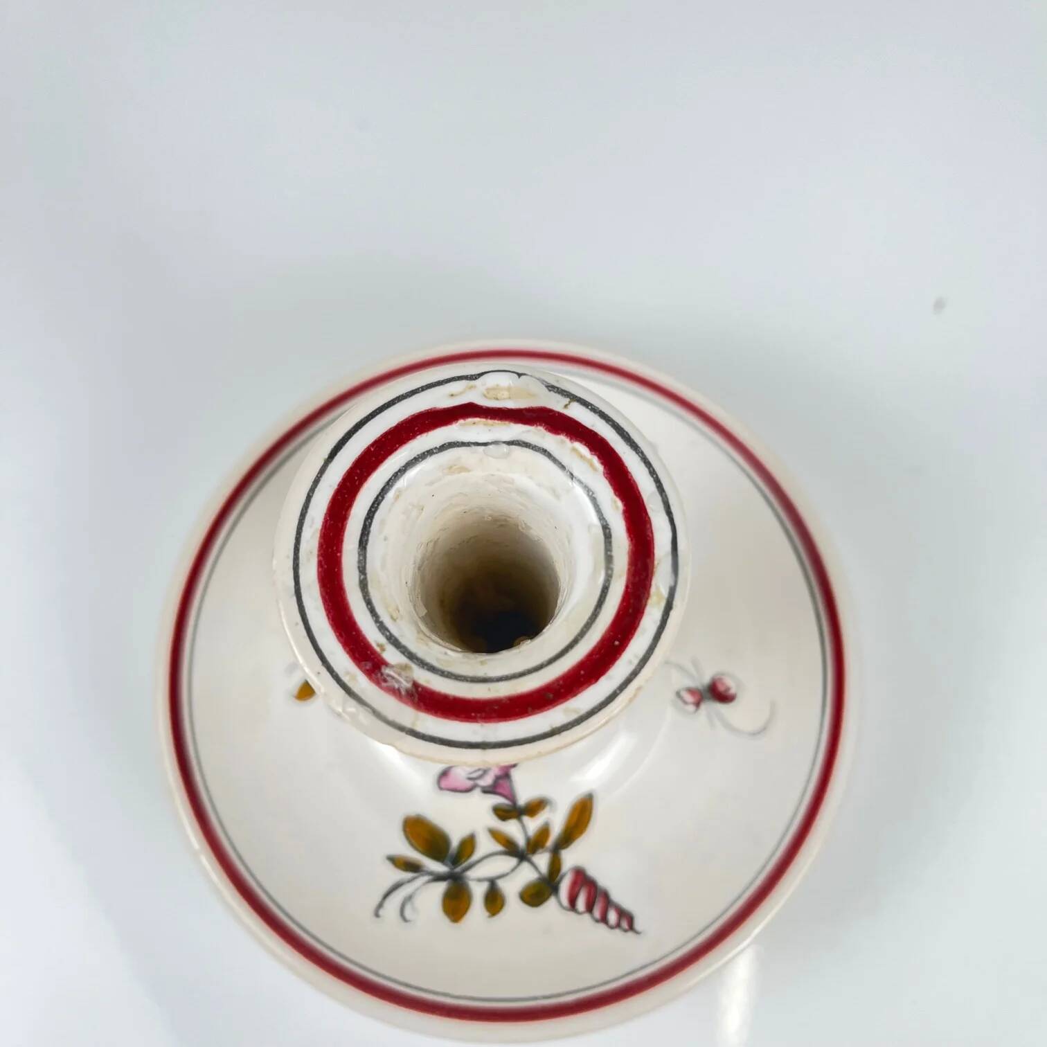 Hand-painted ceramic candlestick, flower pattern.