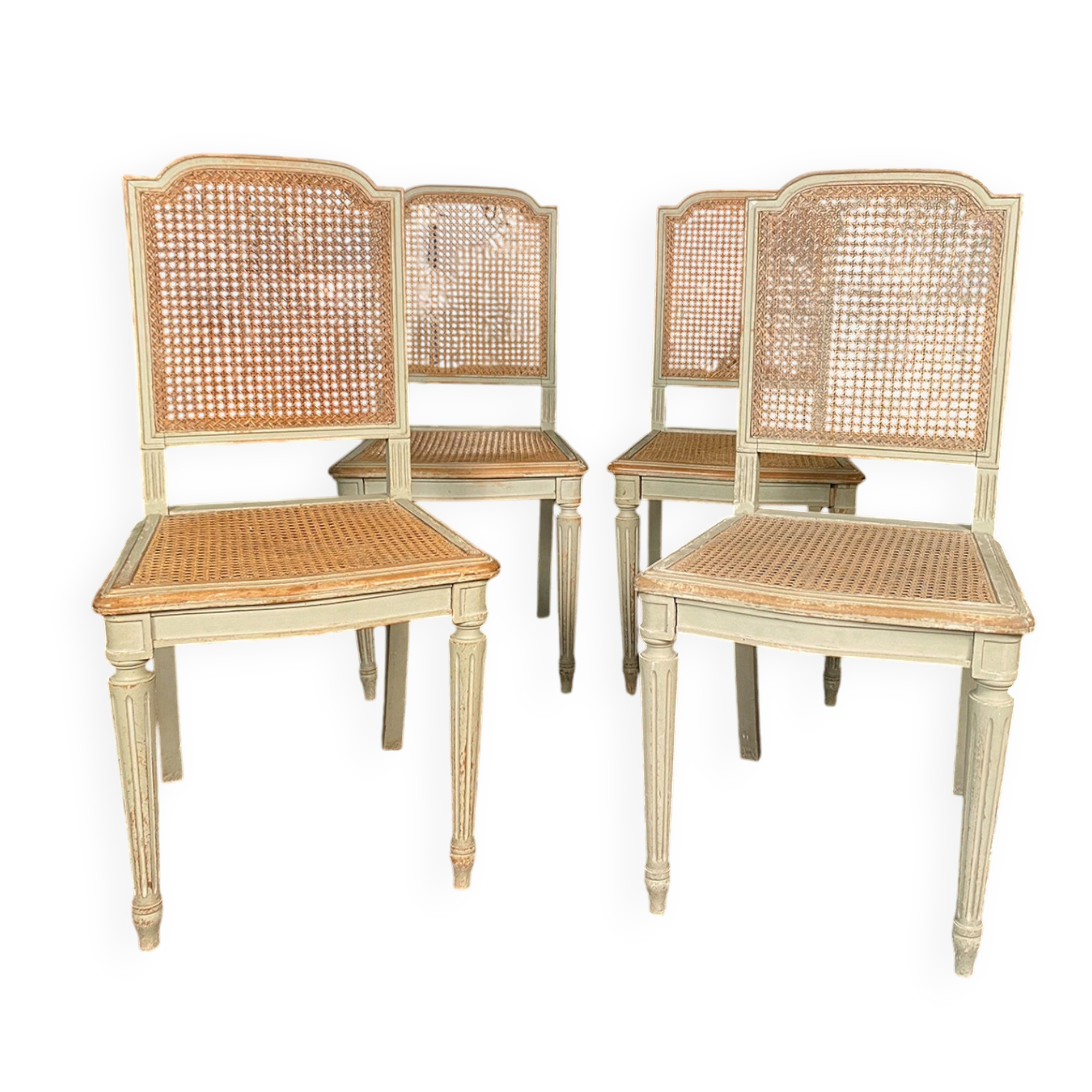 Set of four grey lacquered wooden chairs in the Louis XVI style, late 19th century.