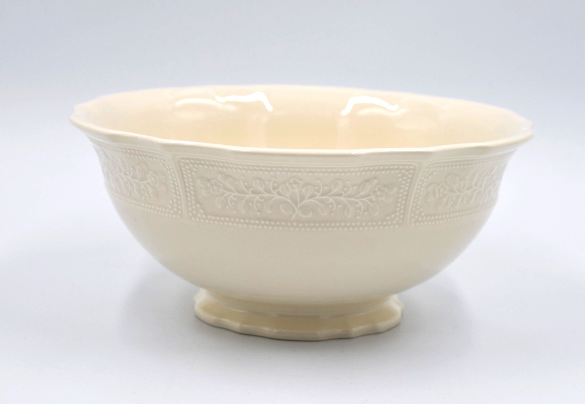 Salad bowl in off-white earthenware ivory Lunéville decoration in relief France