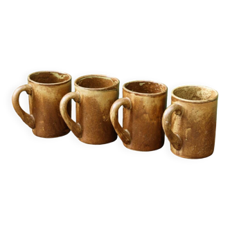 Set of 4 stoneware mugs, signed Jean Gaubier