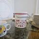 Vintage white opaline ice bucket with red patterns.