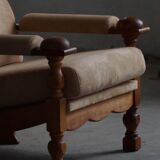 Mid-20th century, pair of armchairs by Henning Kjærnulf, oak and alcantara, 1960s.