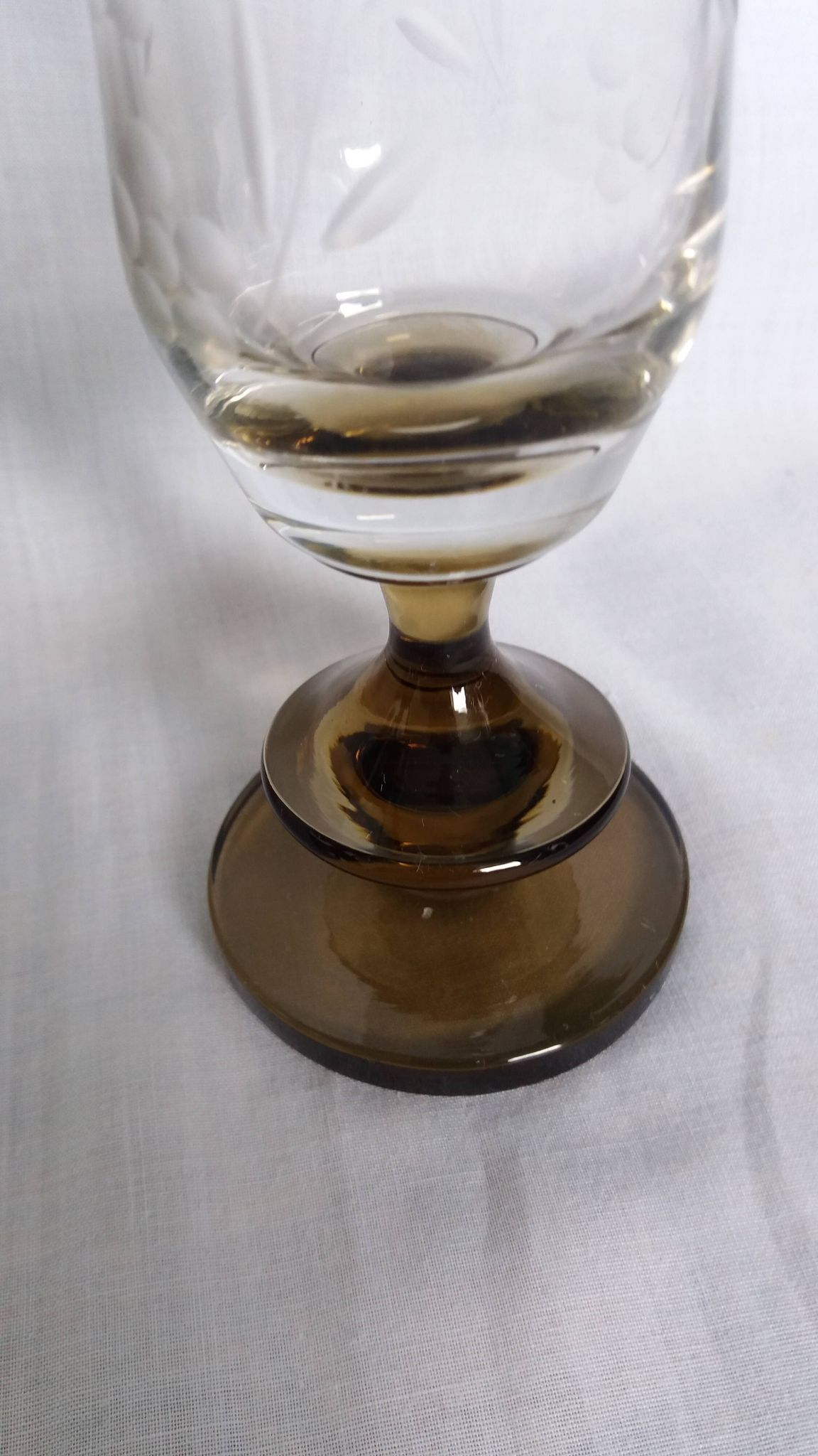 Cut glass soliflore vase with a smoked glass base.