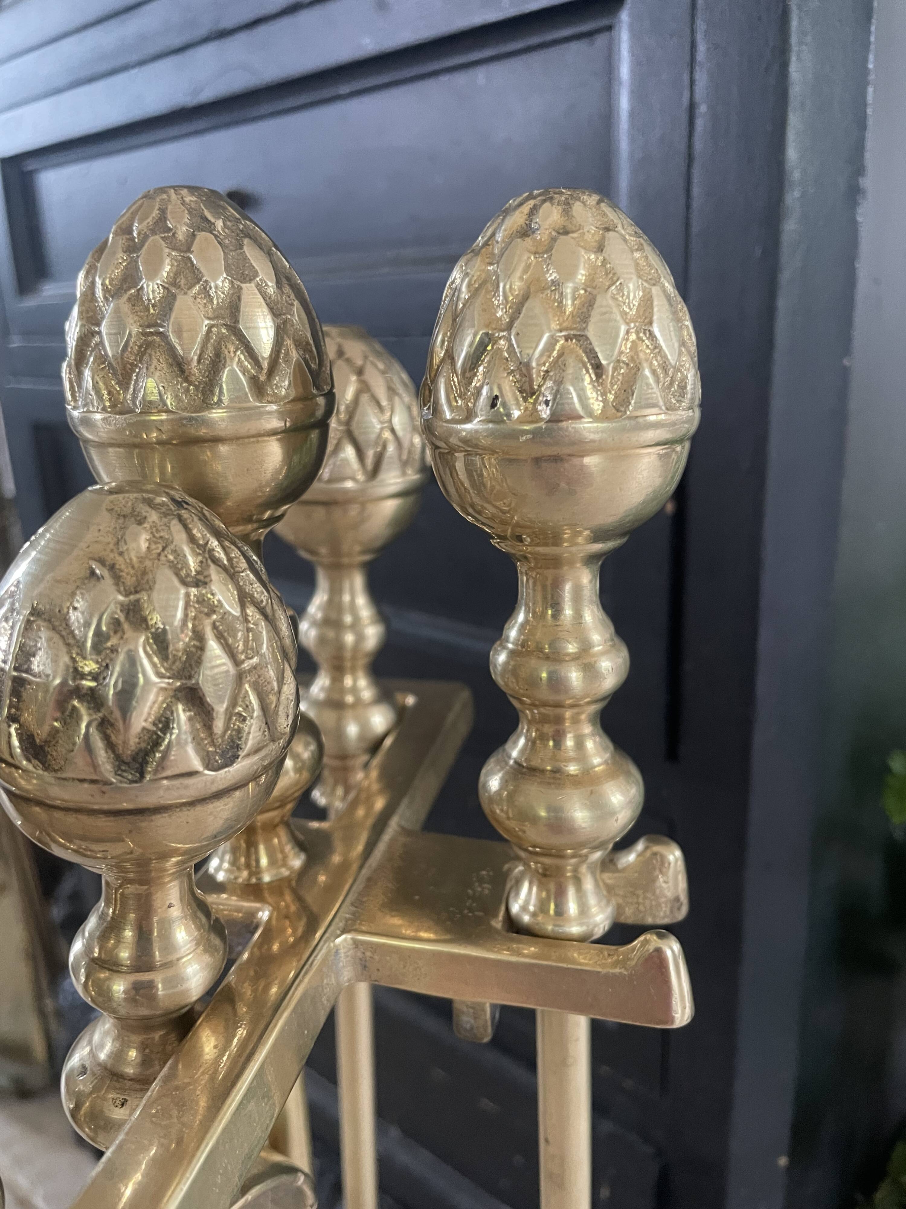 Brass fireplace tools in the style of Maison Baguès.