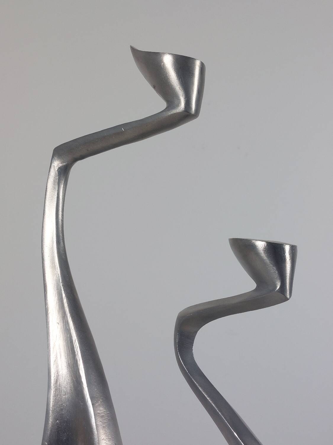 Pair of postmodern aluminium candlesticks by Matthew Hilton