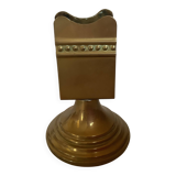 Antique brass match holder with tulip base.