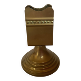 Antique brass match holder with tulip base.
