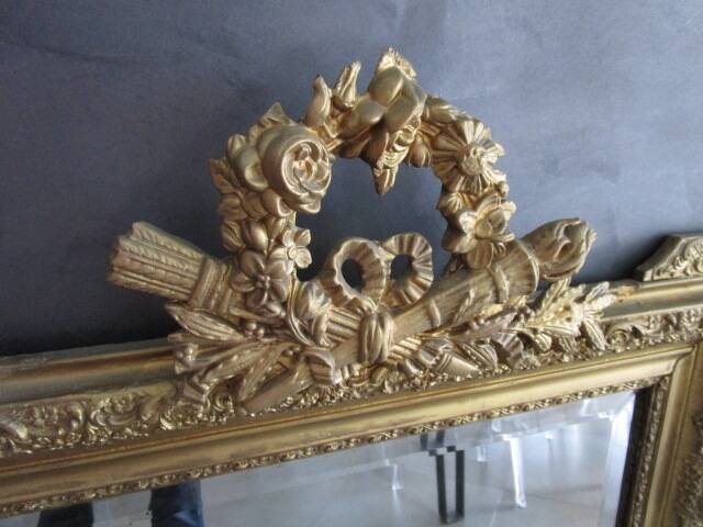 Large antique mirror in wood and gilded stucco.