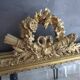 Large antique mirror in wood and gilded stucco.
