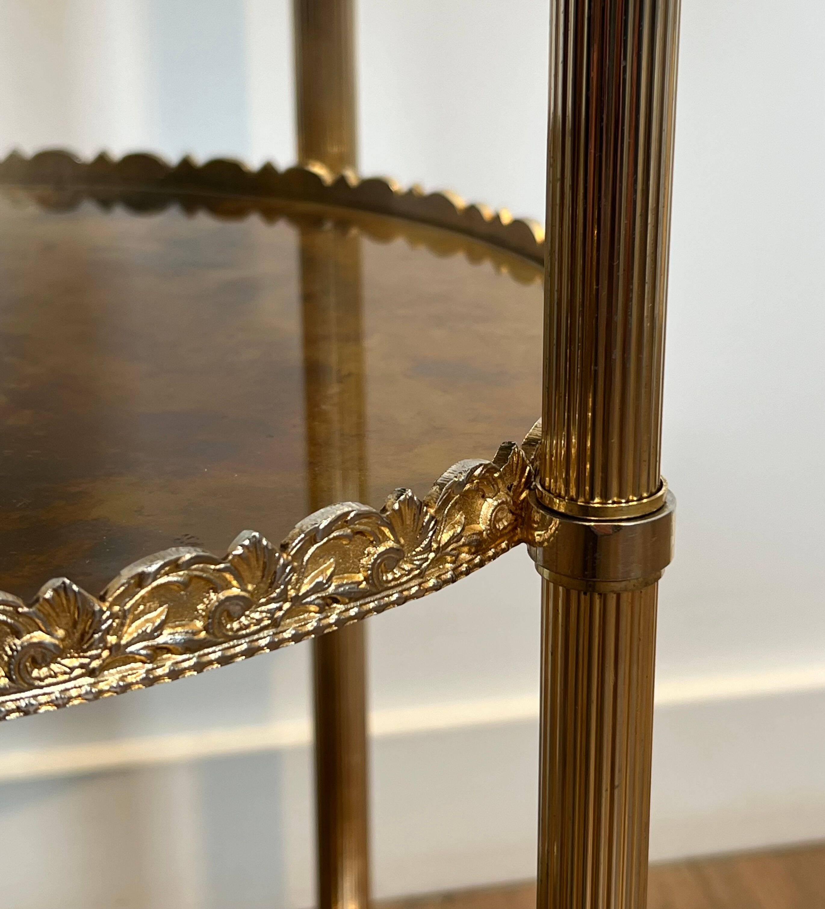 Round silver-plated brass table with triple eglomisé mirror tops from Maison Jansen.