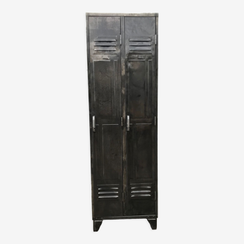 Old metal cloakroom with two panelled doors