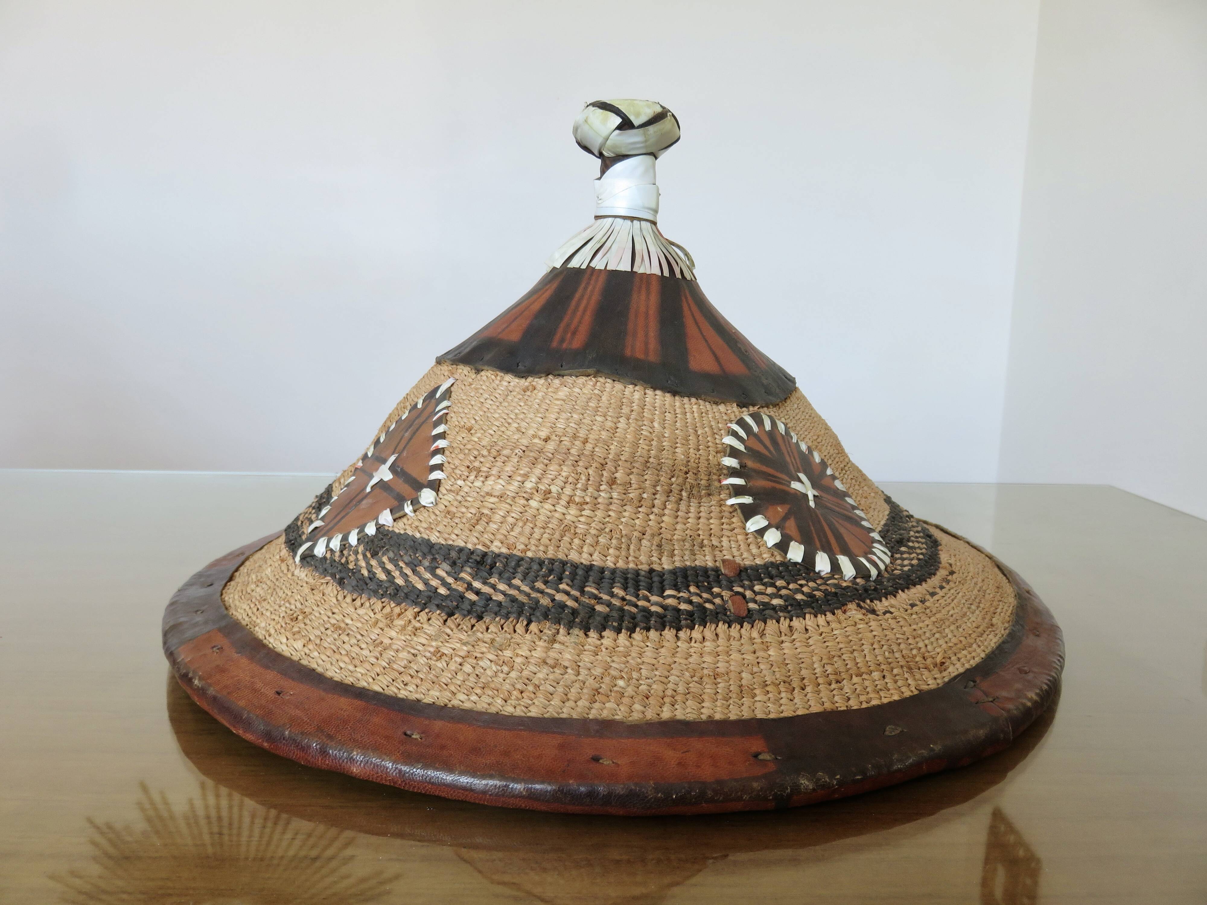 African conical hat, Fulani, in leather and braided rope, 1900, wall decoration