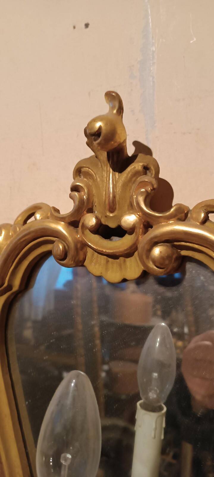 Vintage gold mirror sconces from the late 1950s.