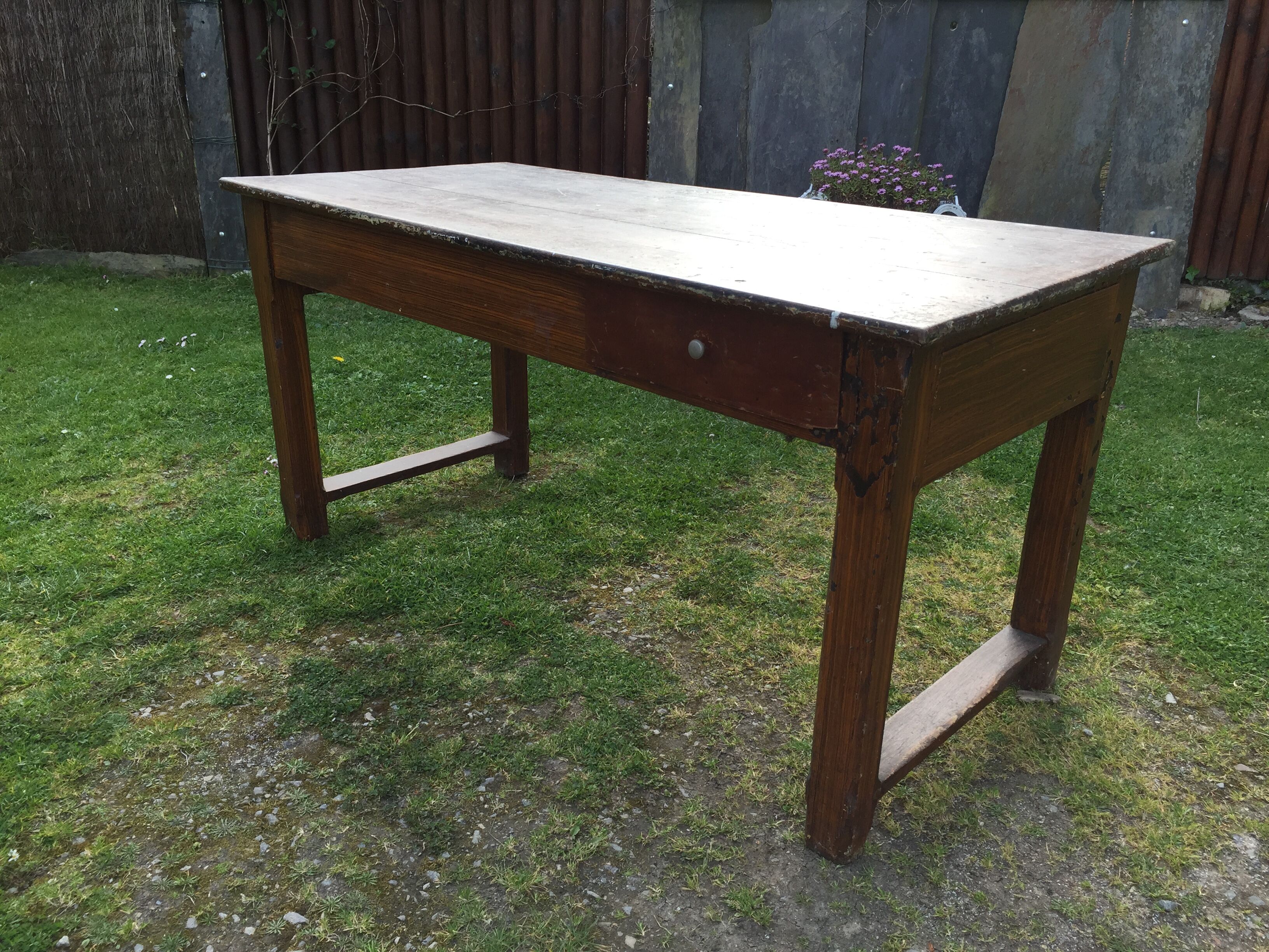 Old farmhouse table in oak painted faux wood old painting.