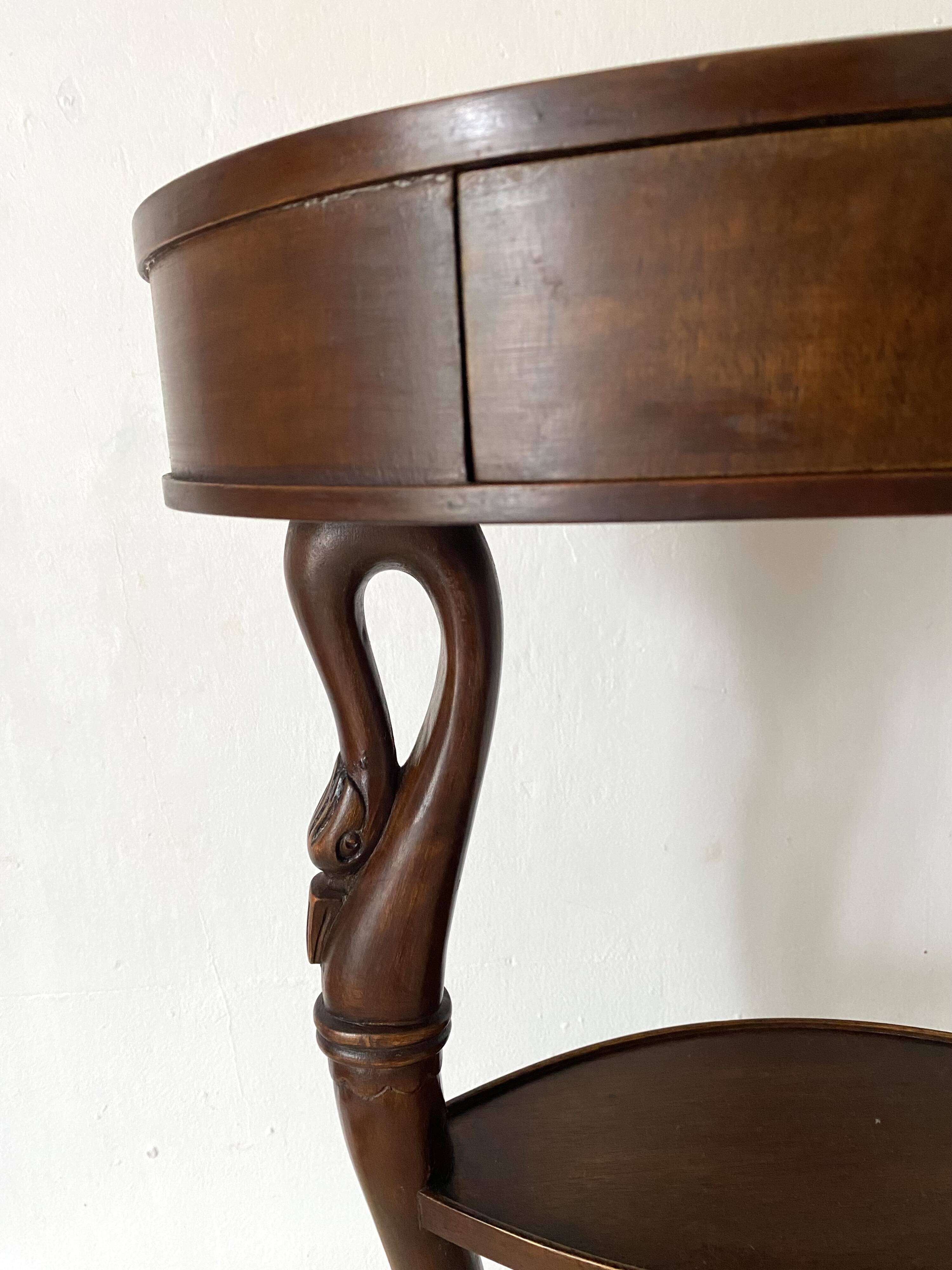 Empire style swan neck and lion paw pedestal table