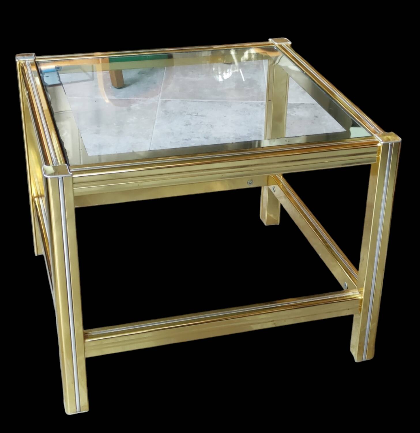 Small designer coffee table in gold metal