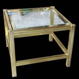 Small designer coffee table in gold metal