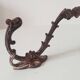 Antique wall coat hook from the 19th century in Victorian cast iron style.