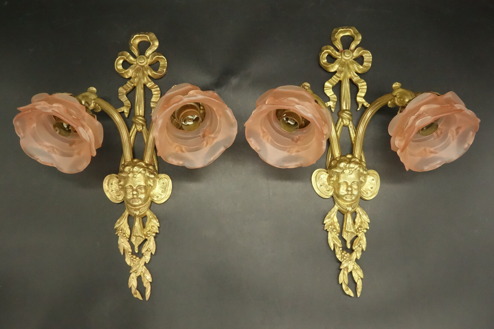 Pair of sconces with the heads of Zephyr Louis XVI style