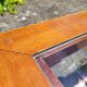 Coffee table in cherry wood, glass and caning.