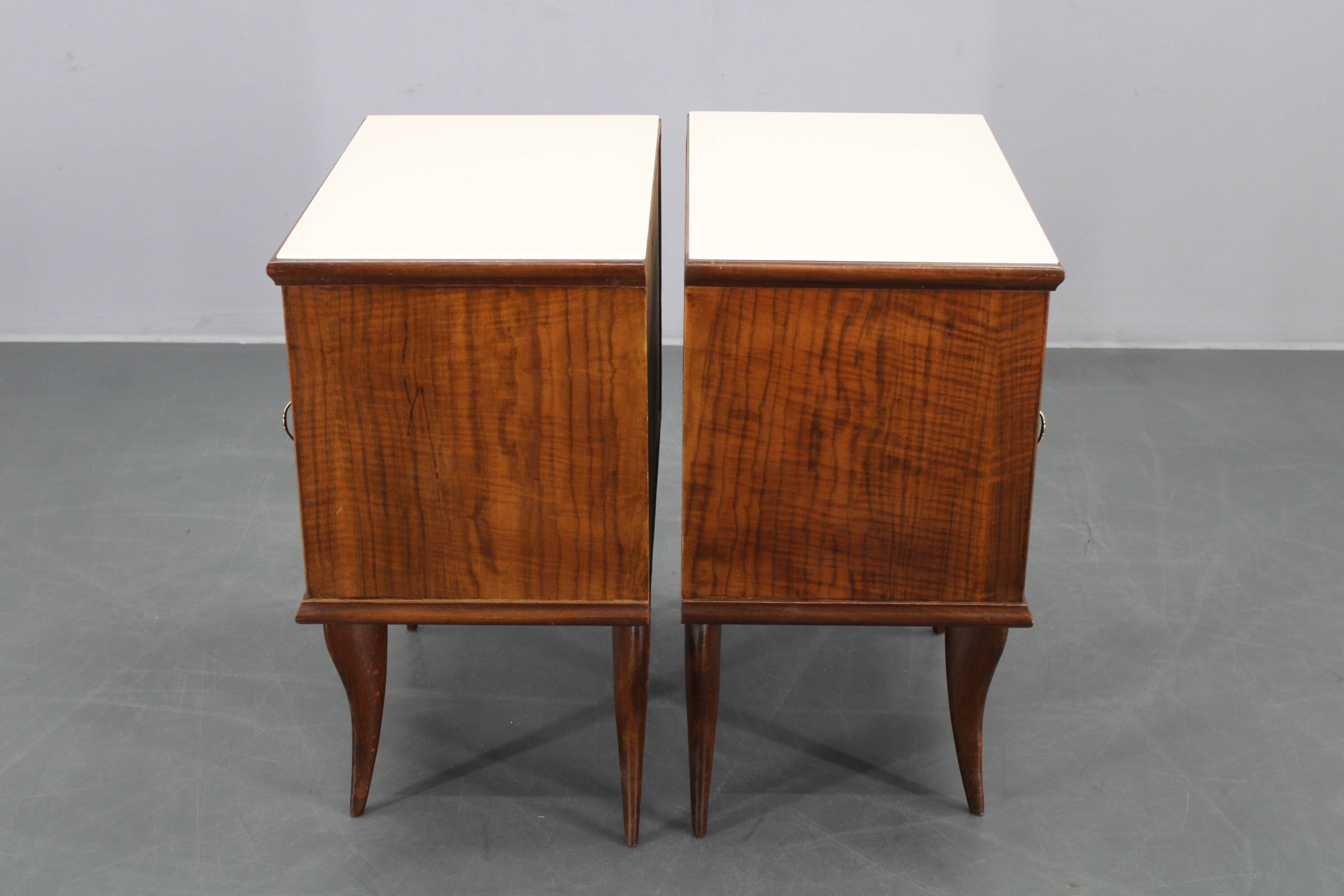Pair of mid-century Italian walnut nightstands with glass top, 1950s
