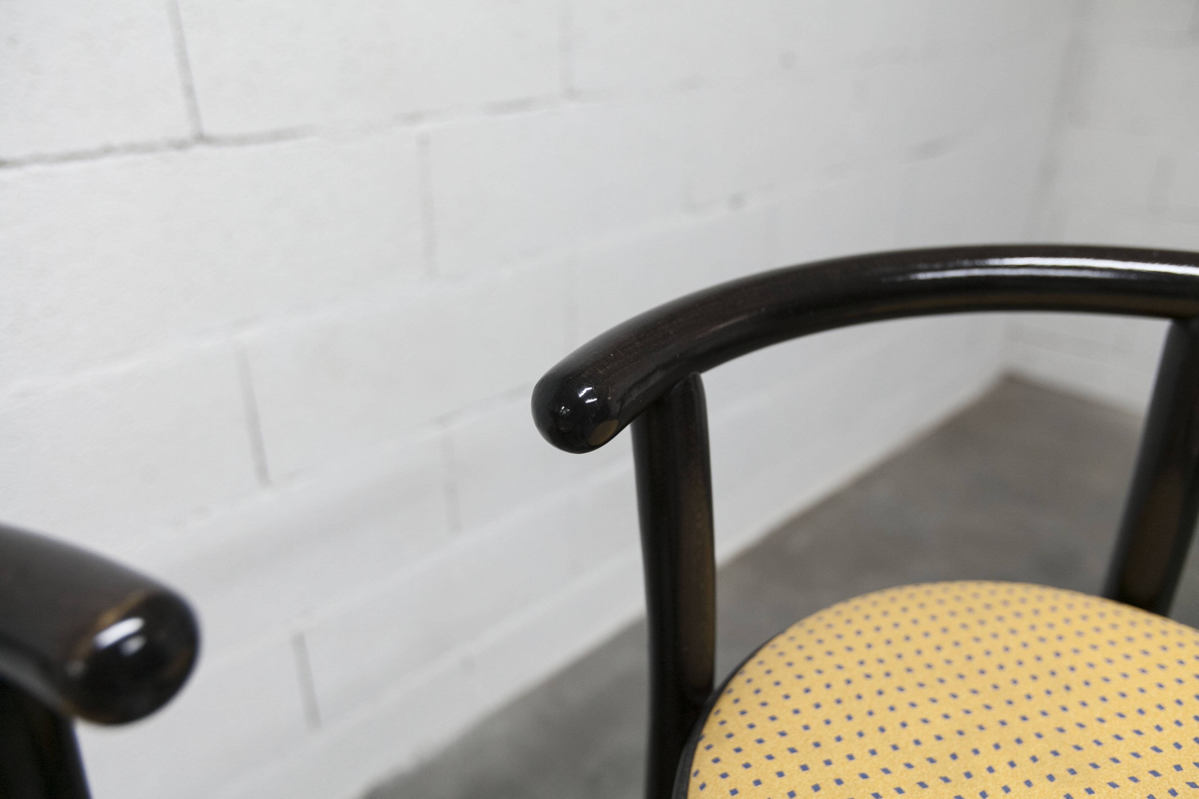 Pair of Baumann Dialog model stools in black and yellow and blue imitation leather, 1990