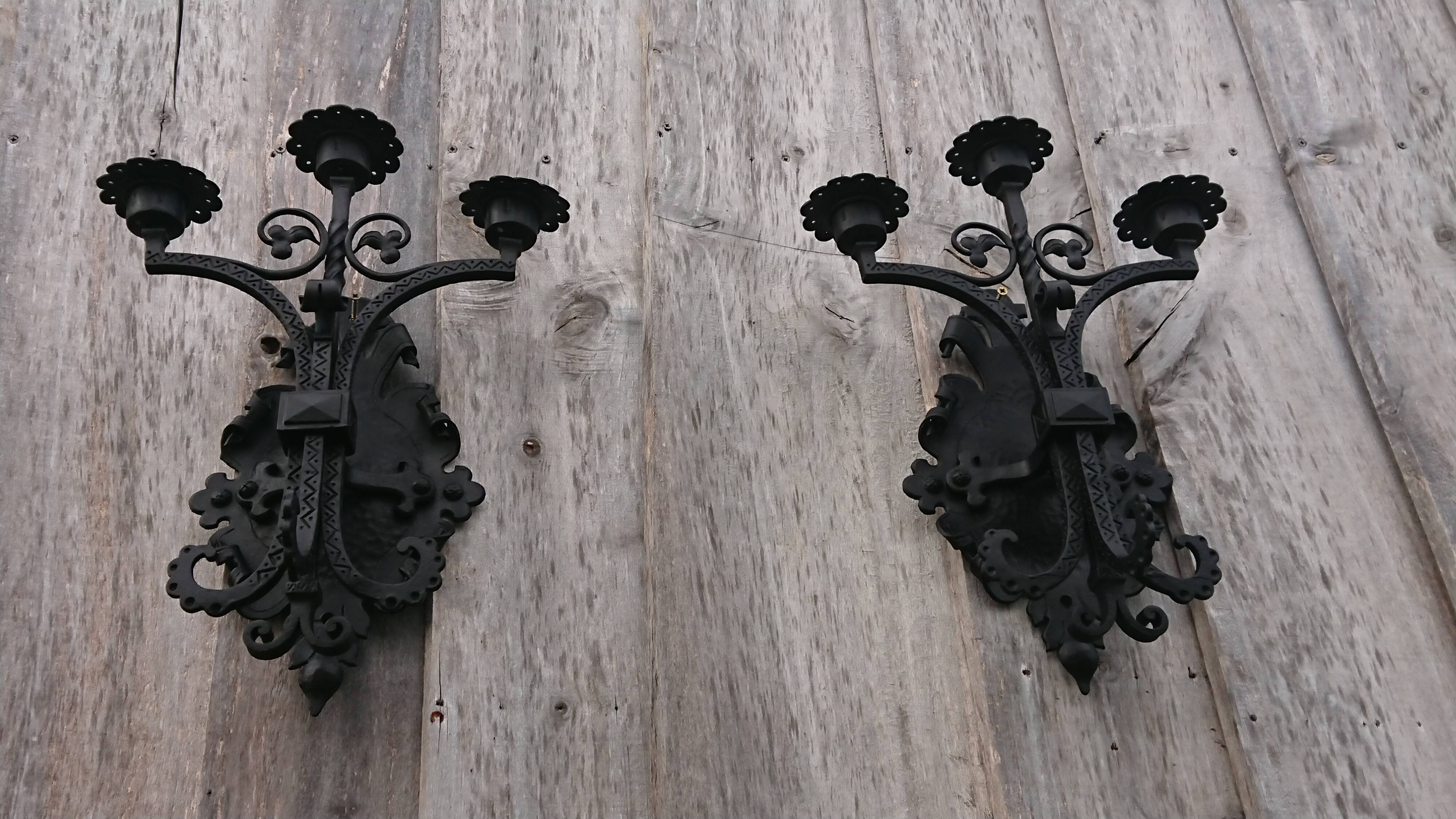 Pair of black wrought iron sconces - neo-Gothic style - from the 1950s