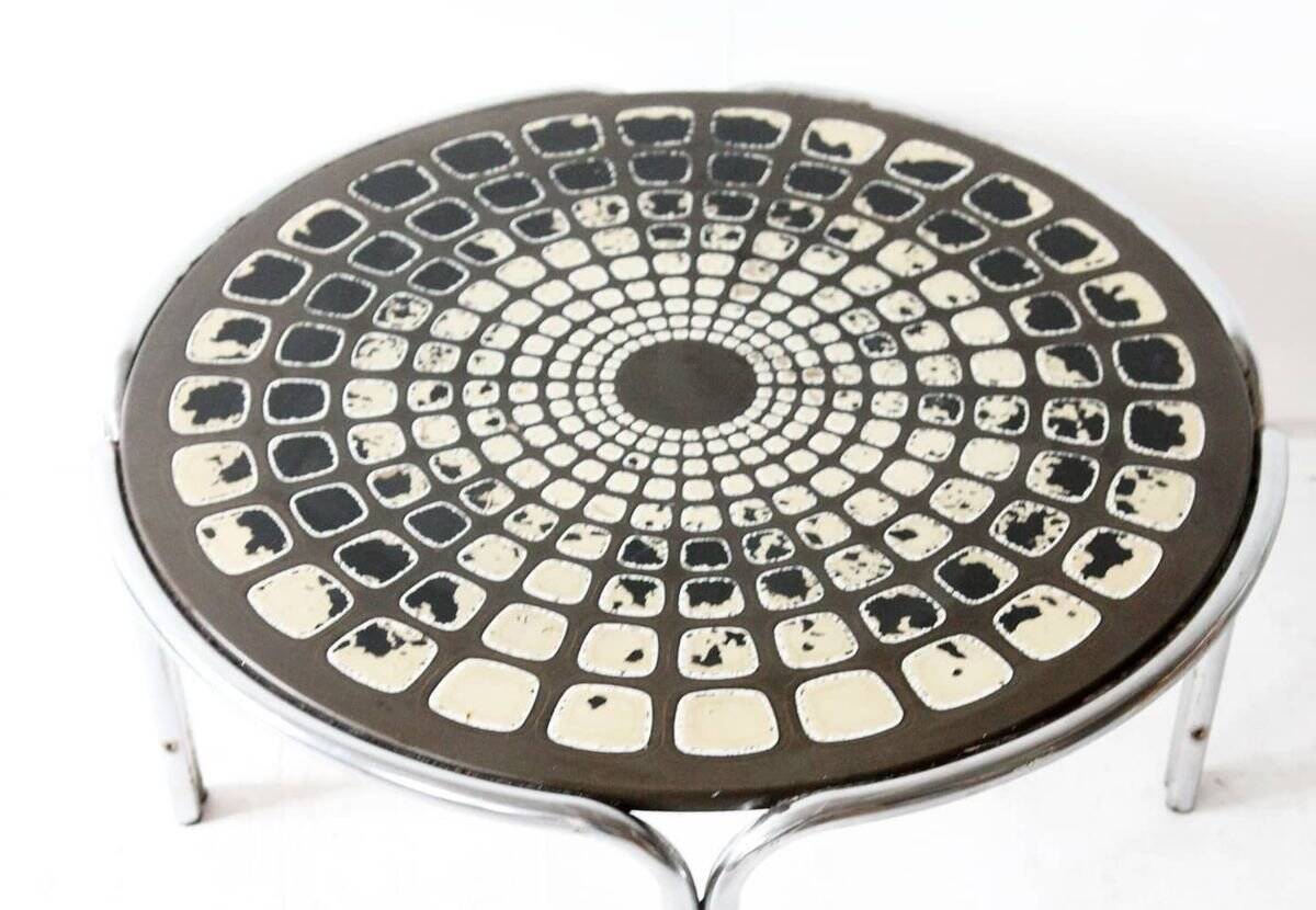 Black and white round coffee table with a mandala top and chrome metal base.